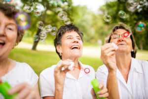 Women blowing bubbles for brain fitness