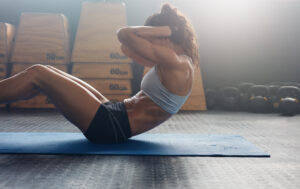 Woman doing crunches for physical fitness