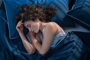 Woman getting good quality sleep to improve brain fitness